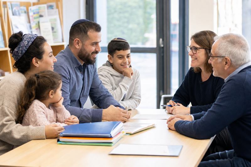 Jewish family from Israel meeting French charity volunteers for integration support